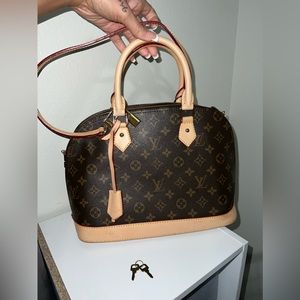 Louis Vuitton Alma Bag! Comes with padlock & keys! In great condition.